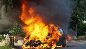 A car couldn't getaway from arson as it burns to the ground.