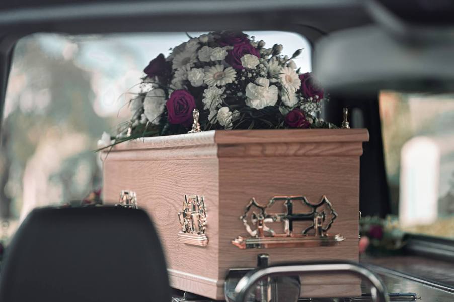 A funeral home transports a coffin containing the deceased, like the body dropped by a funeral service in Poland.