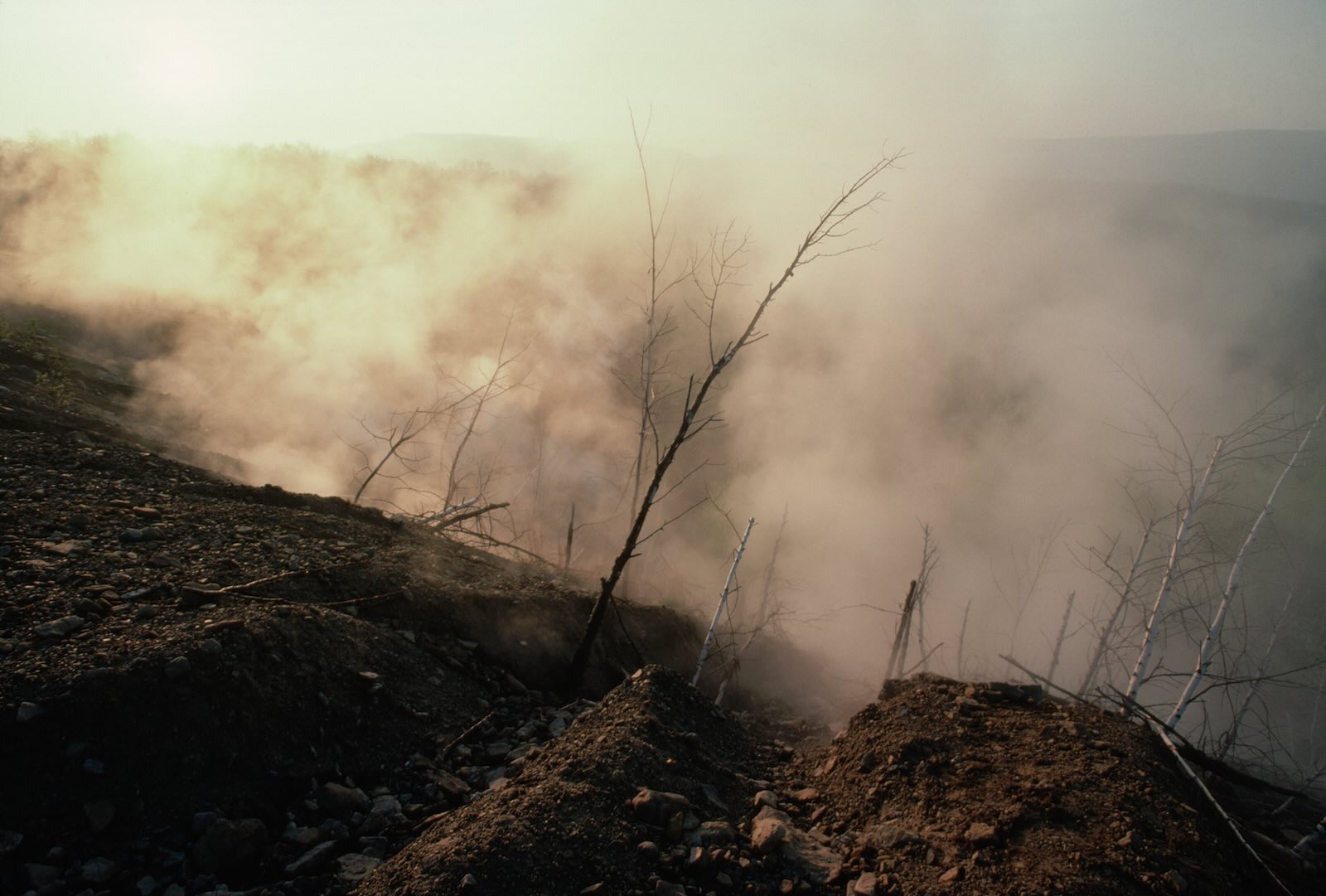 Smoke covers a mountainside as a coal fire burns beneath Centralia, Pennsylvania