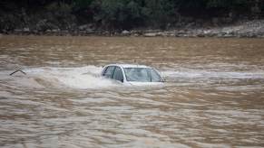A driver will have to file a claim with their car insurance provider after their vehicle has flood damage.