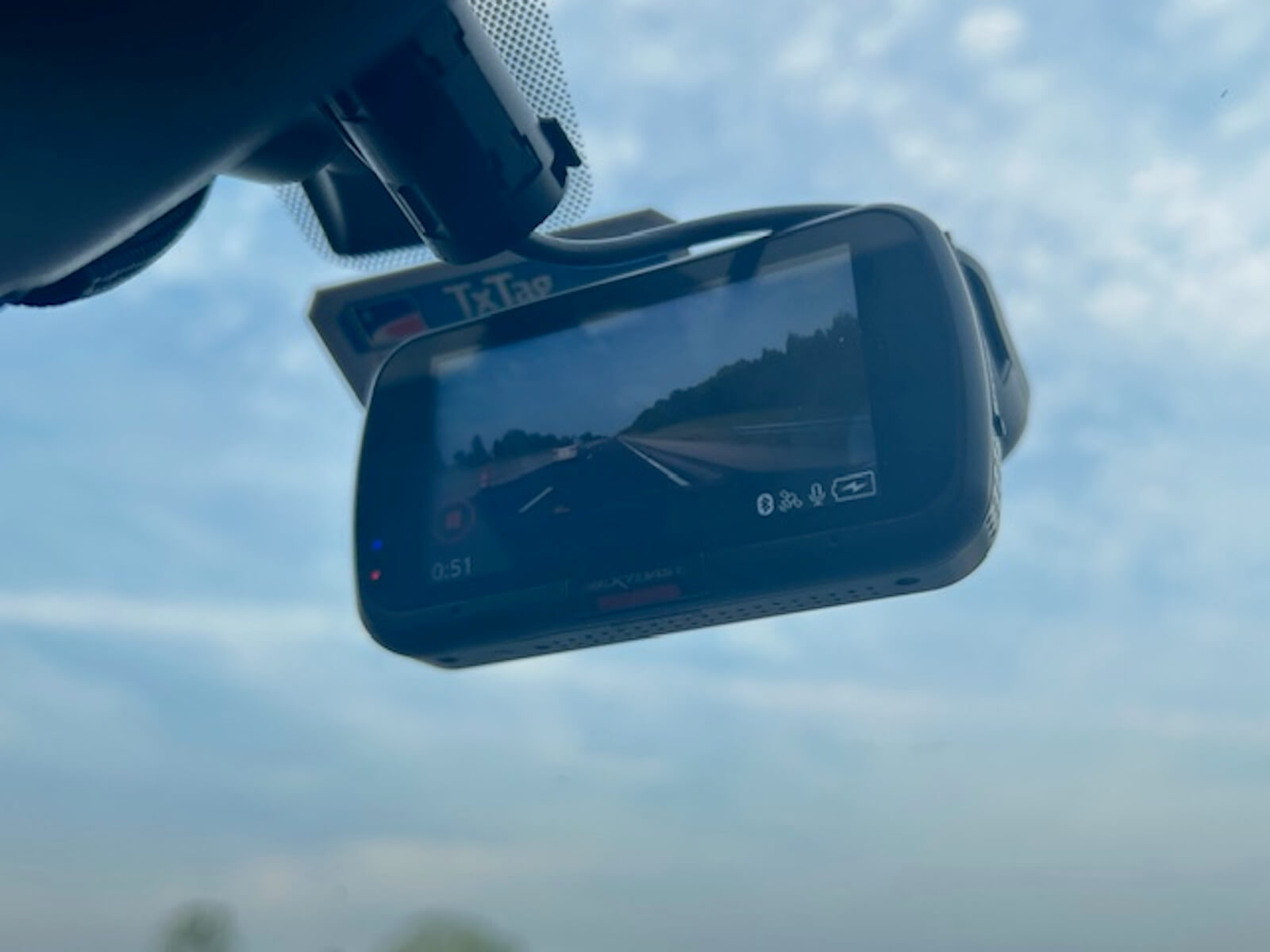 A dash cam points at a highway. 