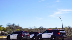 Police cars and SUVs respond to a hit-and-run accident.