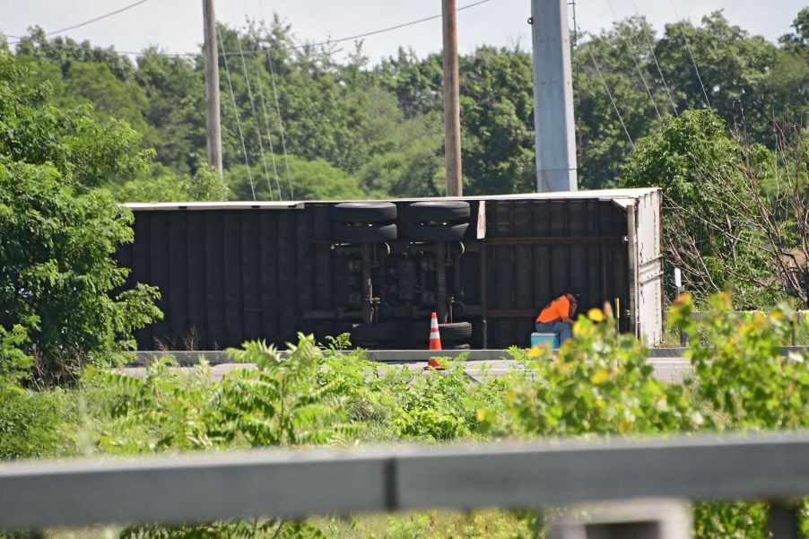 Semi truck rollover after a crash on the highway.