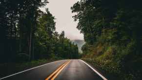 A two-lane paved road in the West Virginia mountains
