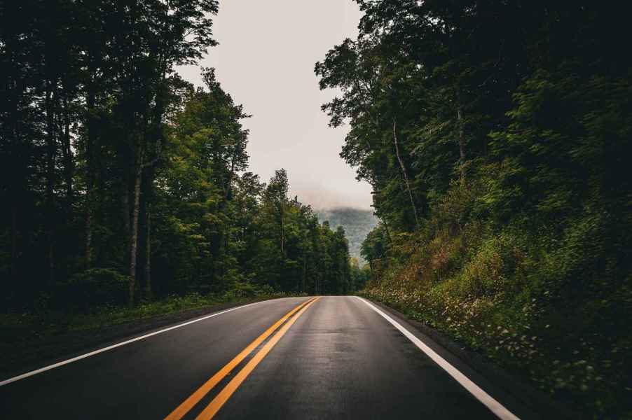 A two-lane paved road in the West Virginia mountains