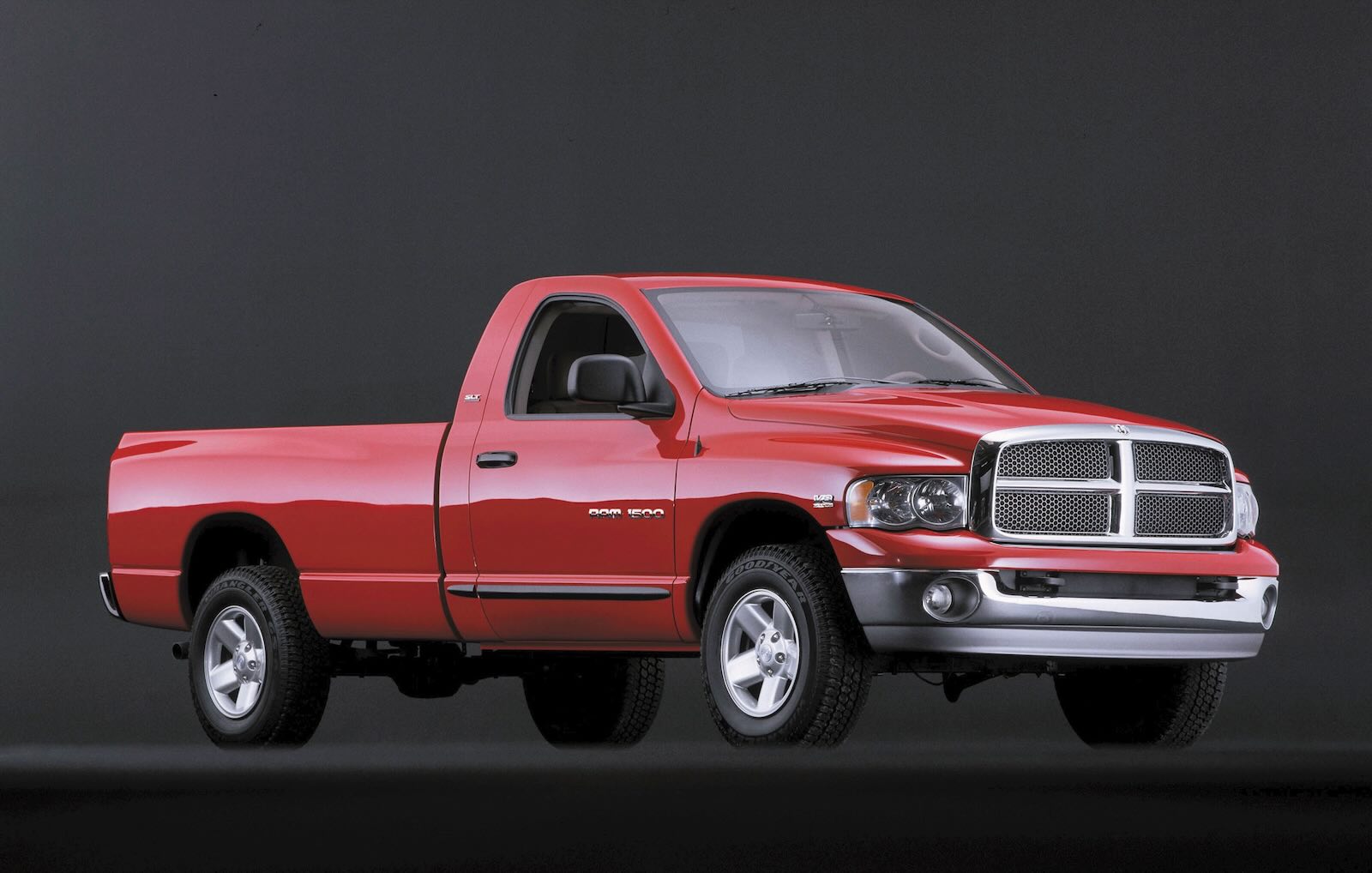Red short cab, long bed Ram 1500 pickup truck.