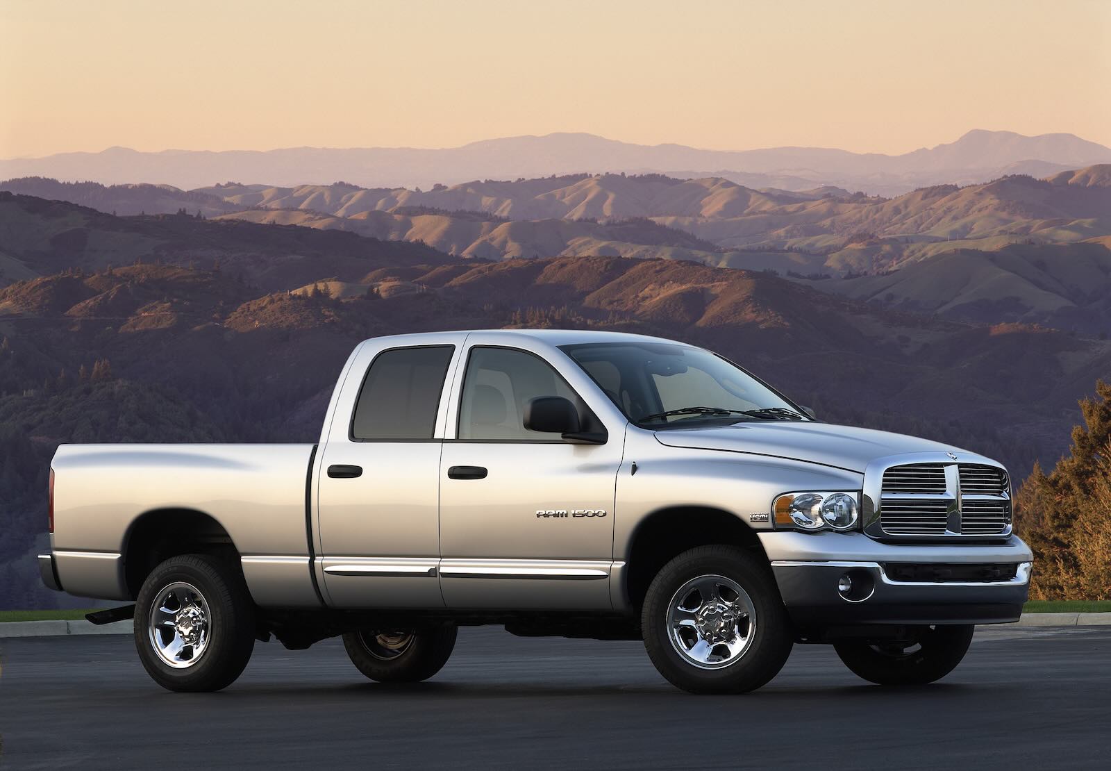 Four-door third-gen Ram 1500 with mountains visible in the background.