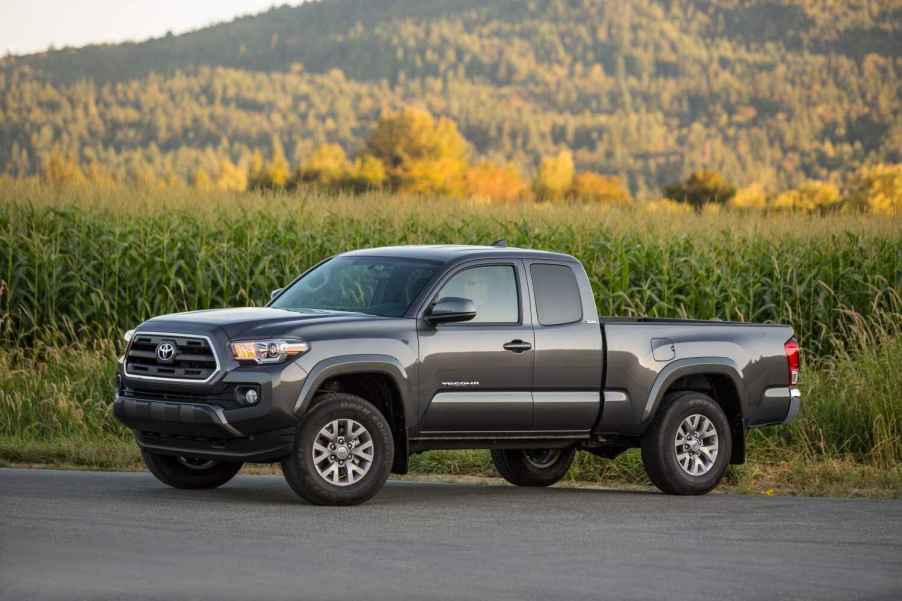 A grey 2016 Toyota Tacoma parked in left side angle view