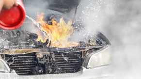 Fire in the engine bay of an overloaded car.