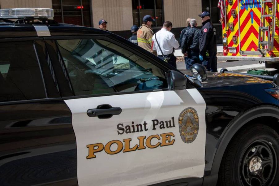 A St. Paul police vehicle at a scene with a field sobriety test and an ambulance.