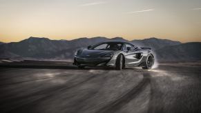 A McLaren 600LT slides on a pad after breaking its rear-wheel traction.
