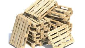 Stack of light wooden pallets on a white background.
