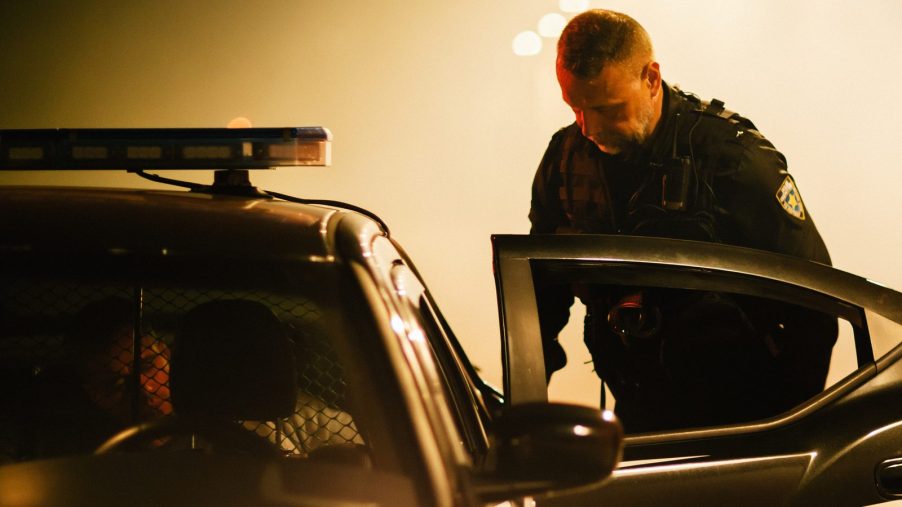 A recent traffic stop ended with the driver trying to "destroy" drugs while in the back of a squad car and being charged.