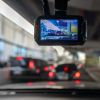 A front facing camera shows the image of cars in front of it, recording