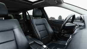 The black interior of a car from right front angle view
