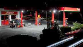 A gas station is photographed at night