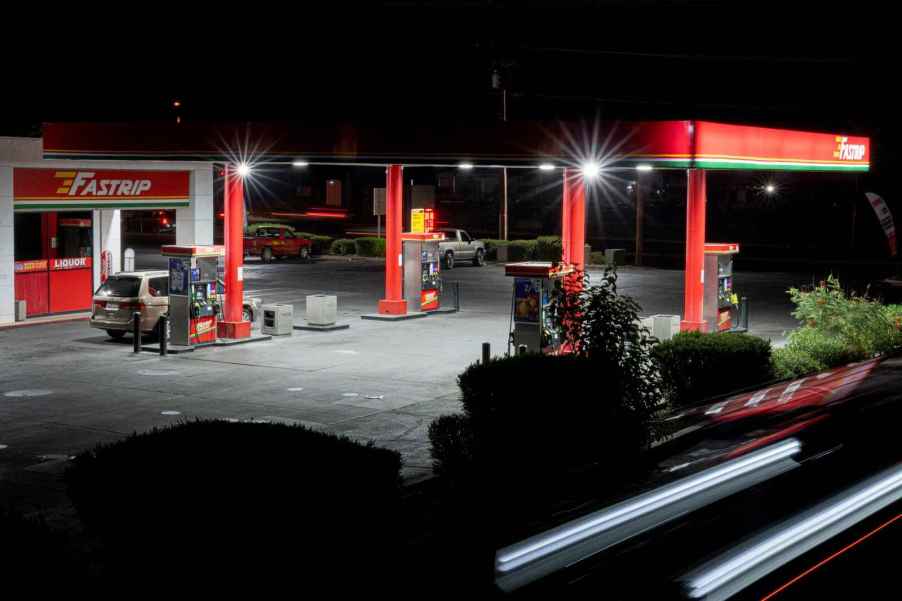 A gas station is photographed at night