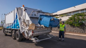 A garbage truck collecting trash