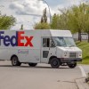 A FedEx truck delivering packages