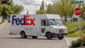 A FedEx truck delivering packages