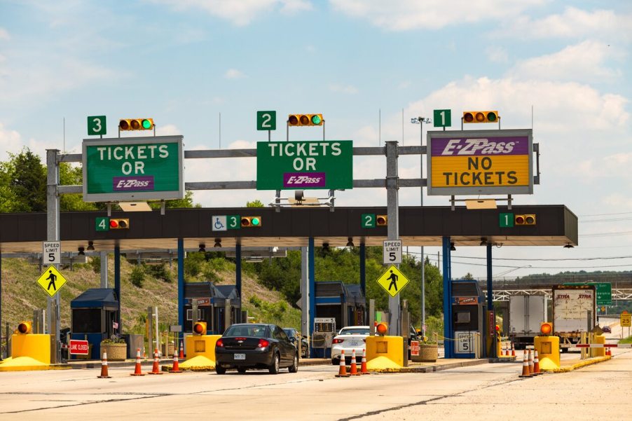 Cars line up to pay to cross a toll bridge