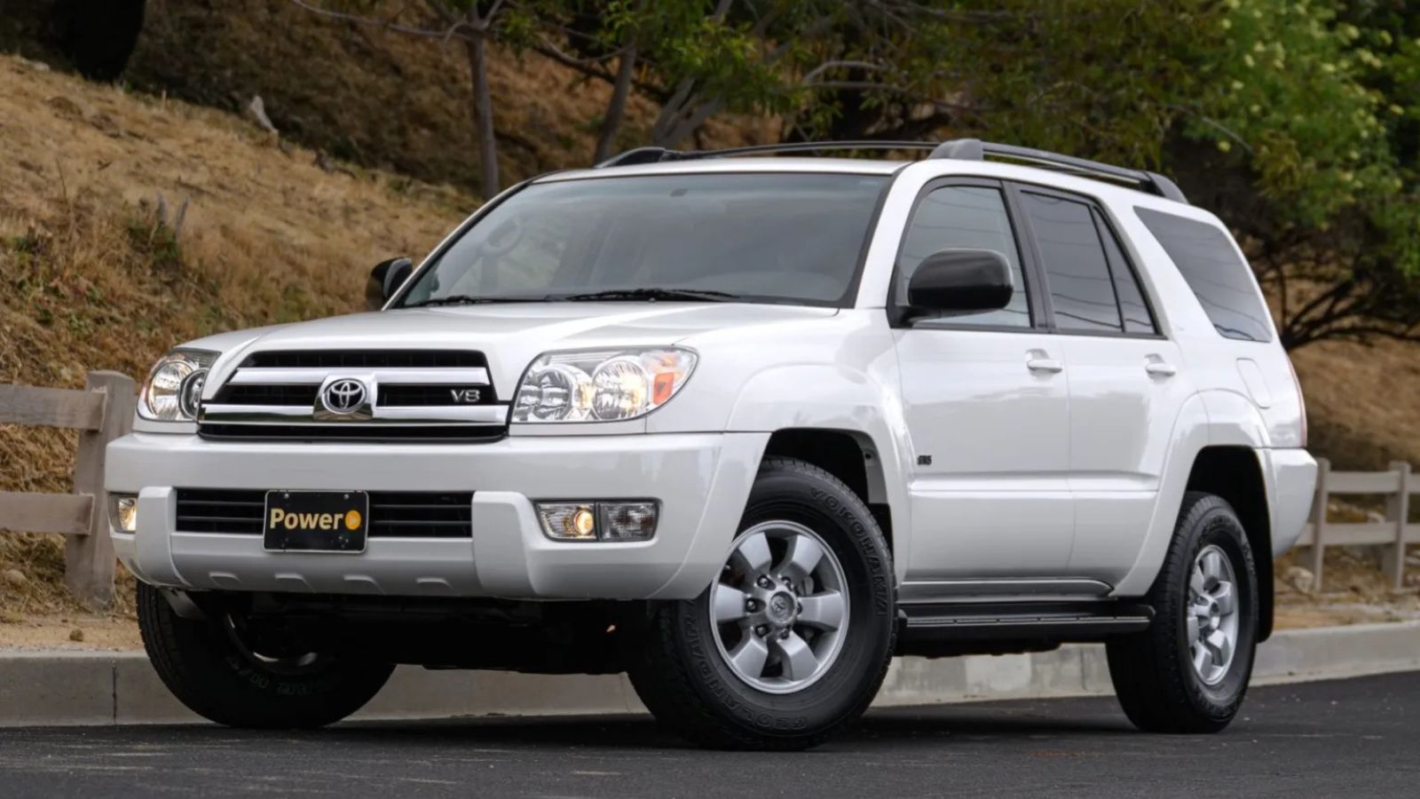 A white 2005 Toyota 4Runner parked in left front angle view