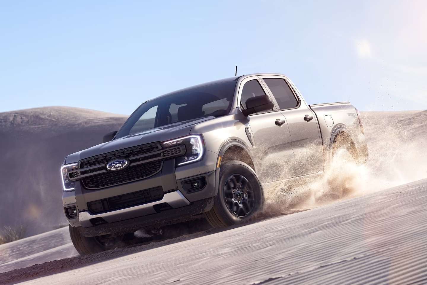 The 2025 Ford Ranger driving through sand