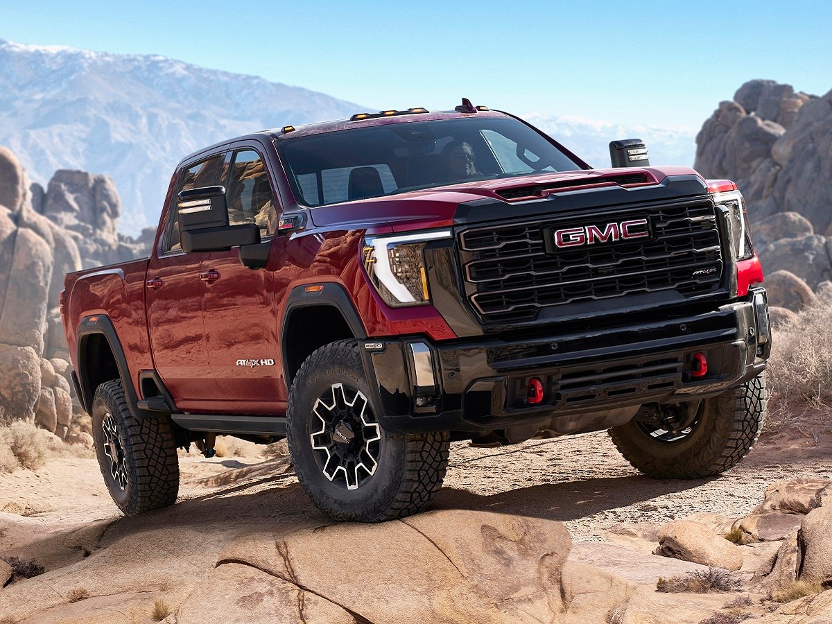 The 2024 GMC Sierra 1500 climbing over rocks