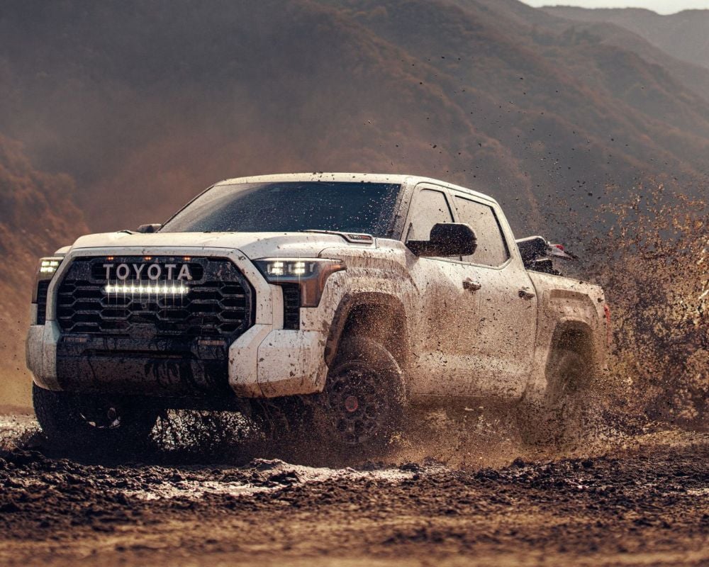 The 2024 Toyota Tundra splashing through mud
