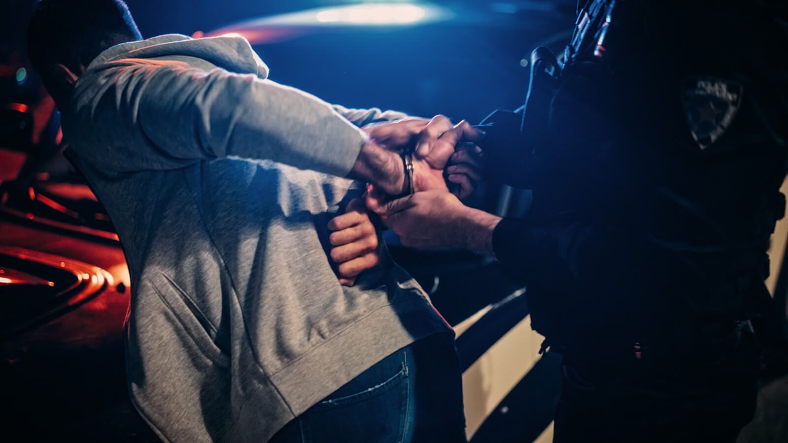A police officer in the middle of a DUI arrest.