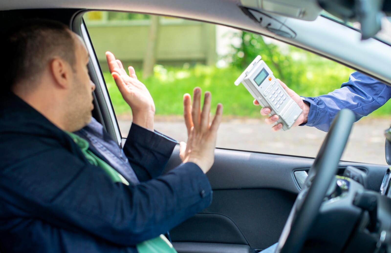 A driver declining a police breathalyzer test at a traffic stop.