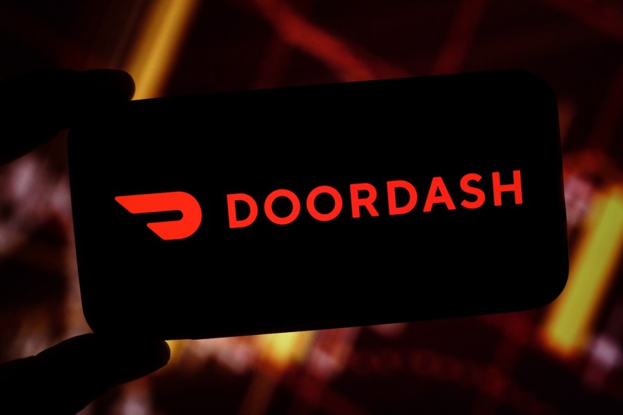 The DoorDash logo on a phone