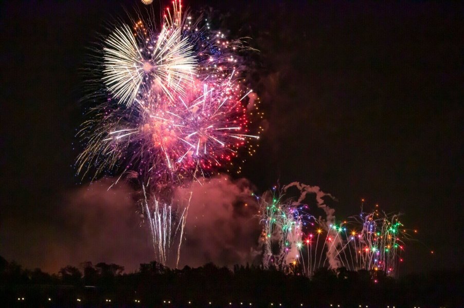 People fire off a volley of fireworks during a warm Florida night.