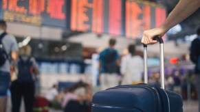 A plane passenger isn't 'flying naked' with his rolling luggage.