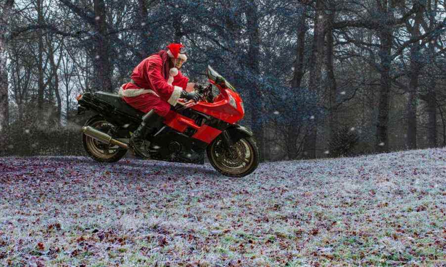 A Santa Claus on a sport bike, like the Florida man who ran from the cops dressed as Santa.