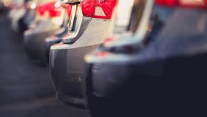 A lot with cheap used cars in a row.