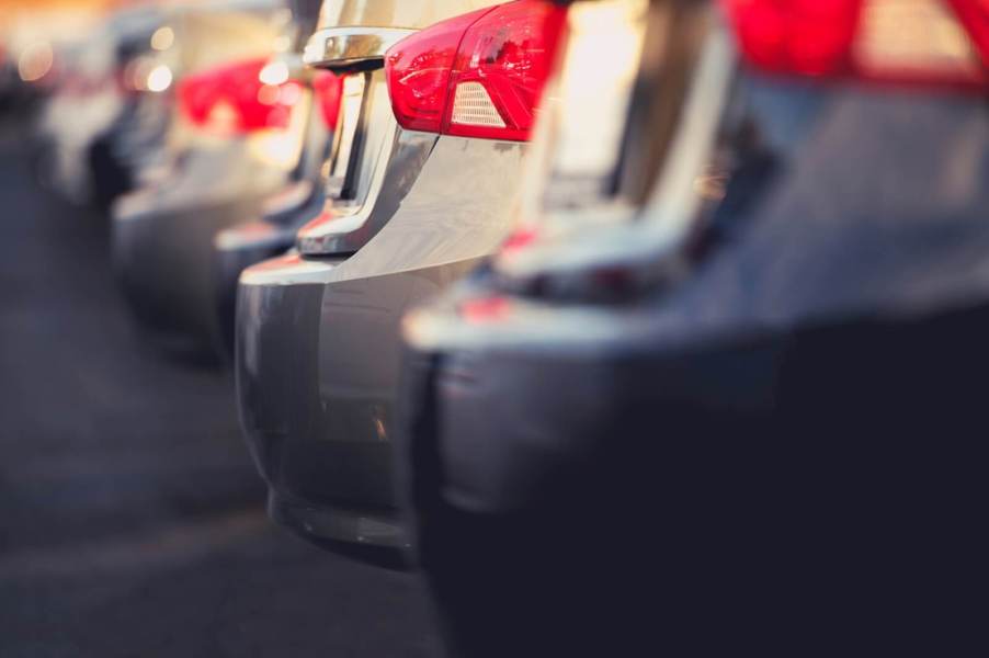 A lot with cheap used cars in a row.