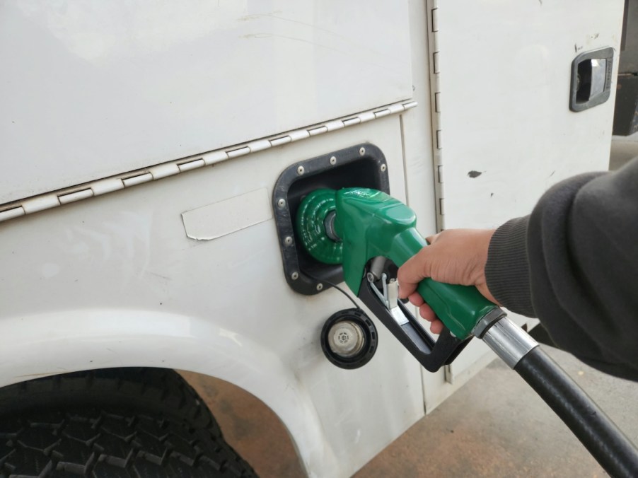 Driver fueling up a fleet vehicle.