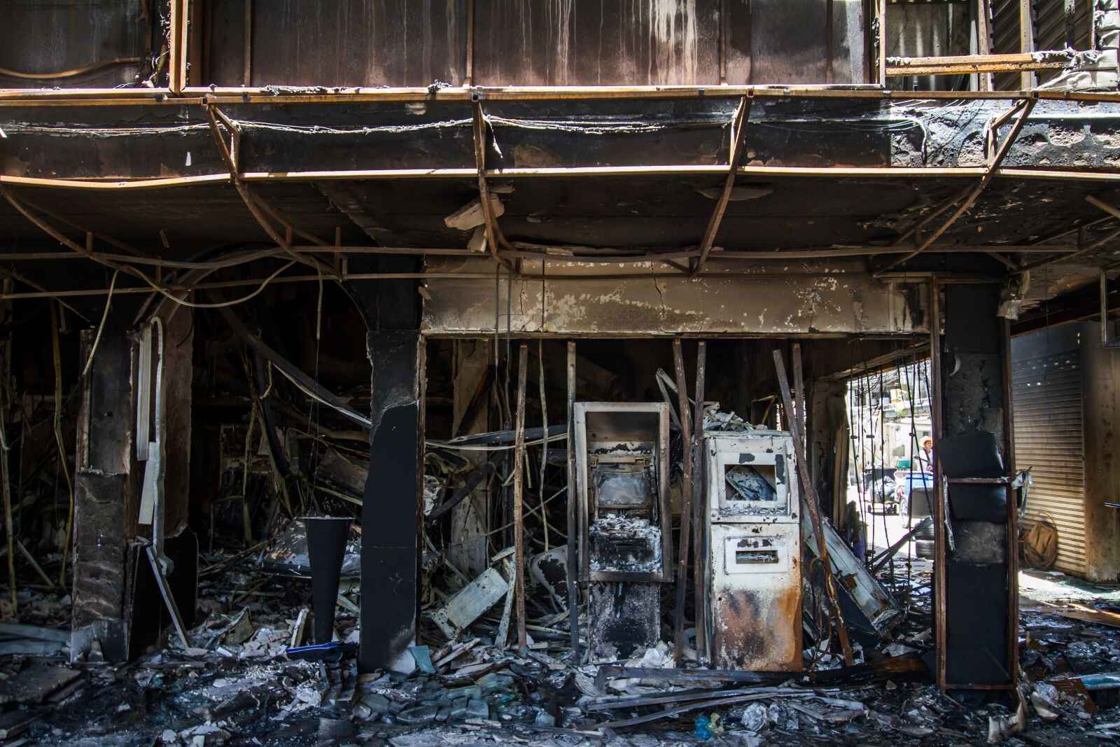 The inside of a burned dealership, showcasing the damage