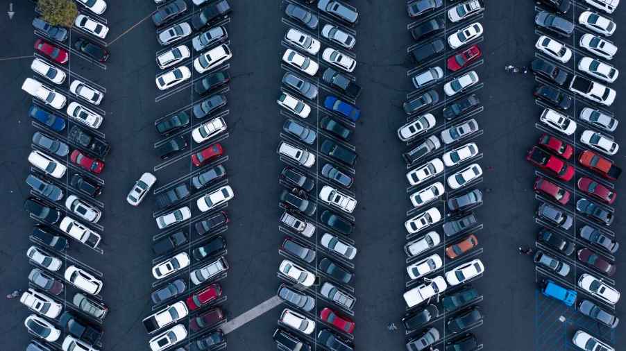 rows of cars parked in lot from an aerial view