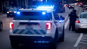 An Illinois police cruiser pulled over with lights flashing during a traffic stop