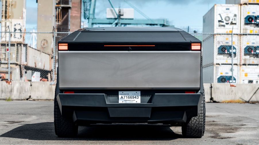 A Tesla Cybertruck's rear end, showing the license plate