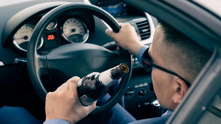 Police saw men drinking tequila in a car and then driving down the wrong lane. A traffic stop revealed they were felons with guns.