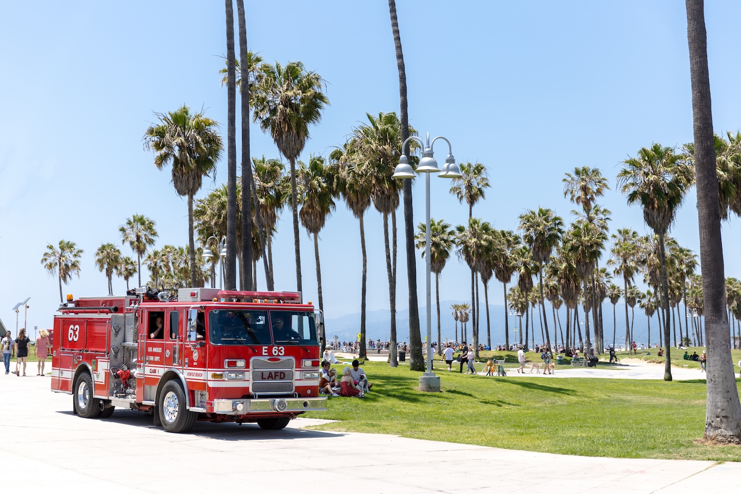 A firetruck parked at the beach