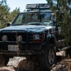 a modified Jeep Cherokee XJ going off-road
