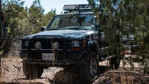 a modified Jeep Cherokee XJ going off-road