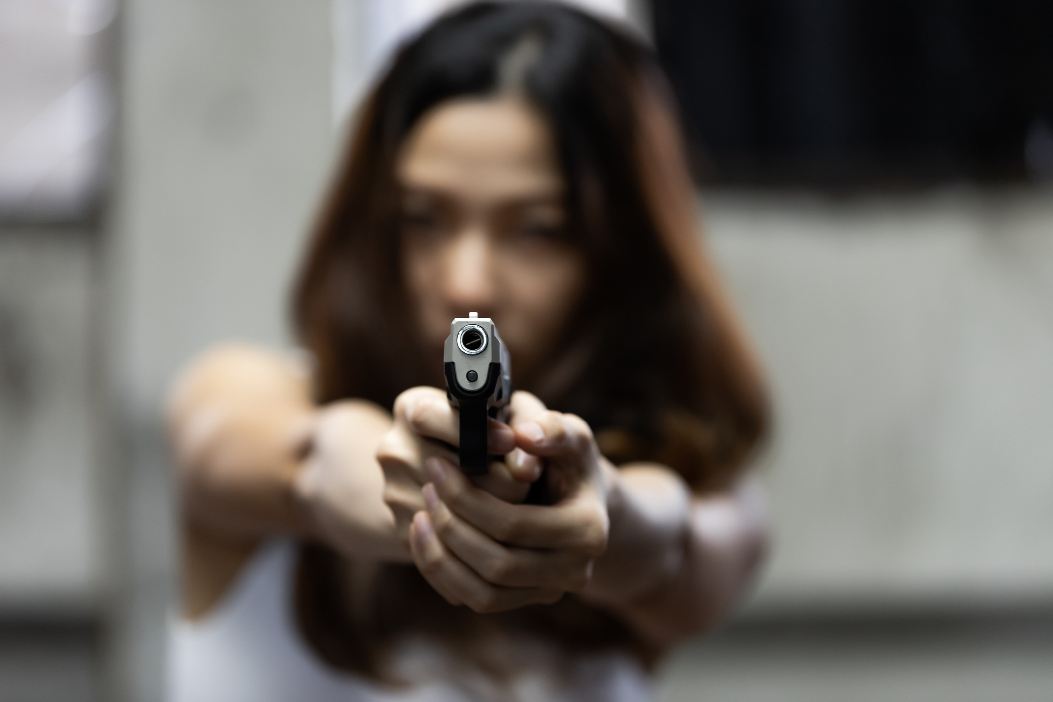 A woman with a pistol 