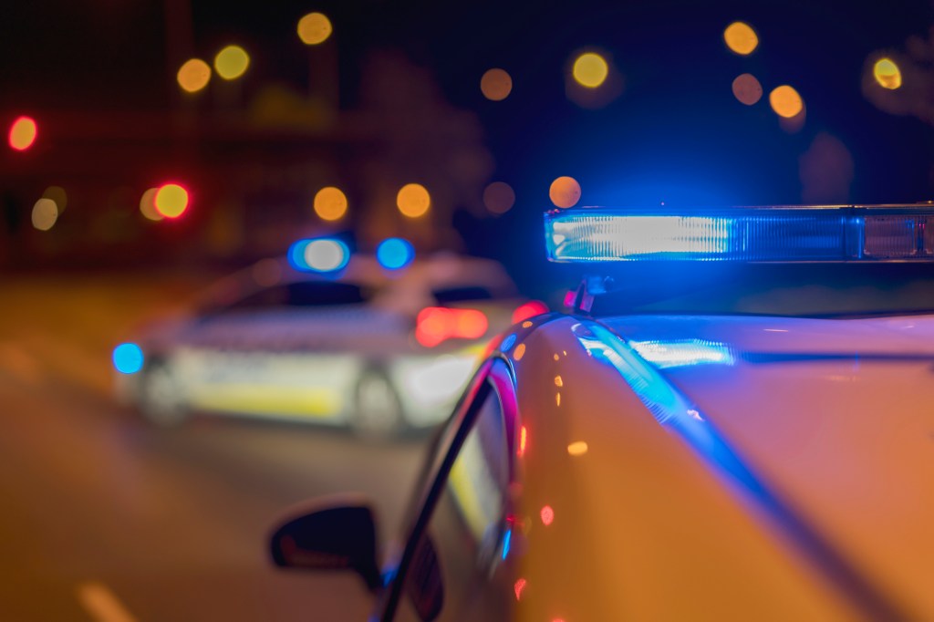 Two police cars with flashing lights