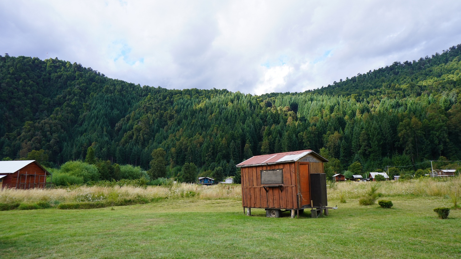 A tiny home in an open field