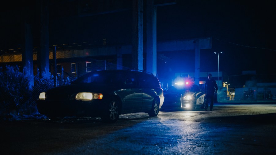 A police car behind an SUV